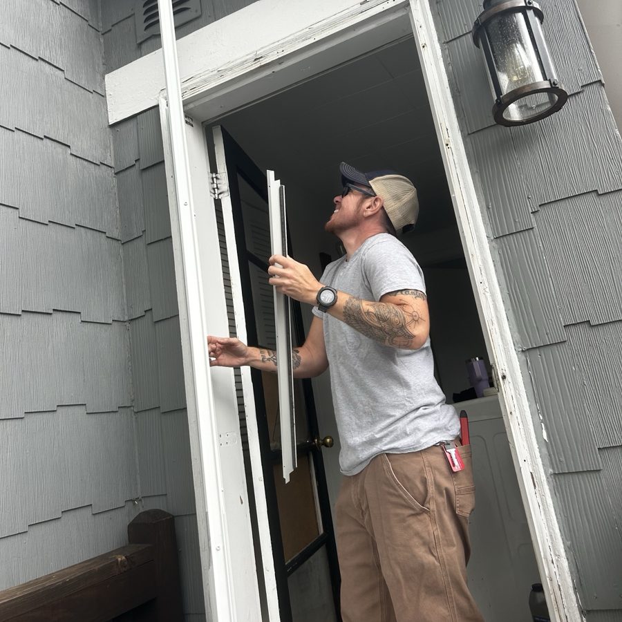 Fitting a new storm door frame in a doorway